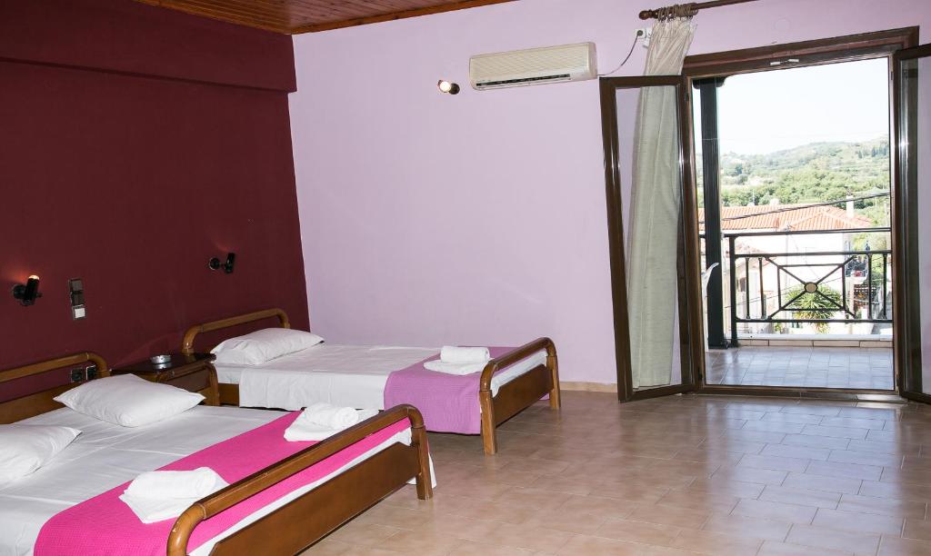 Postel nebo postele na pokoji v ubytování Petania Hotel & Apartments