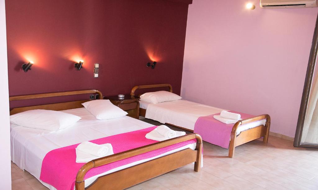 Postel nebo postele na pokoji v ubytování Petania Hotel & Apartments