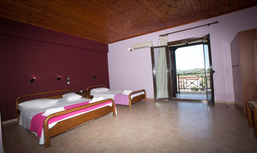 Postel nebo postele na pokoji v ubytování Petania Hotel & Apartments