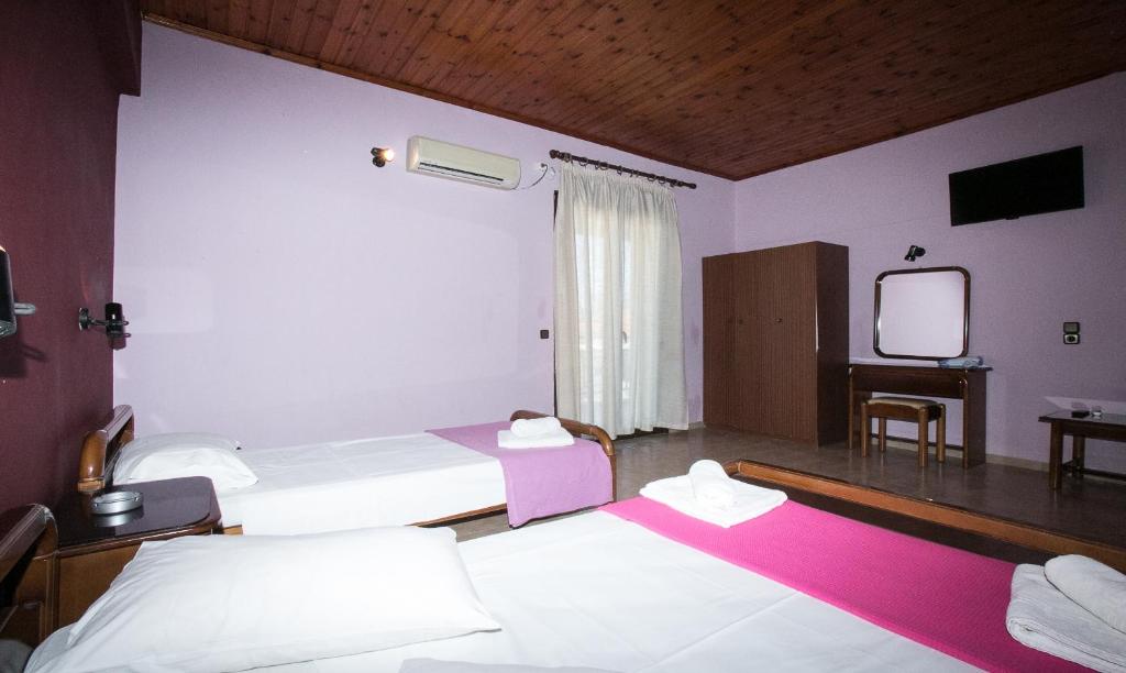 Postel nebo postele na pokoji v ubytování Petania Hotel & Apartments