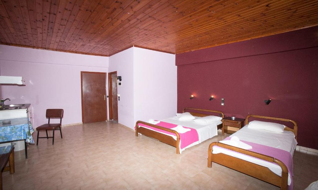 Postel nebo postele na pokoji v ubytování Petania Hotel & Apartments