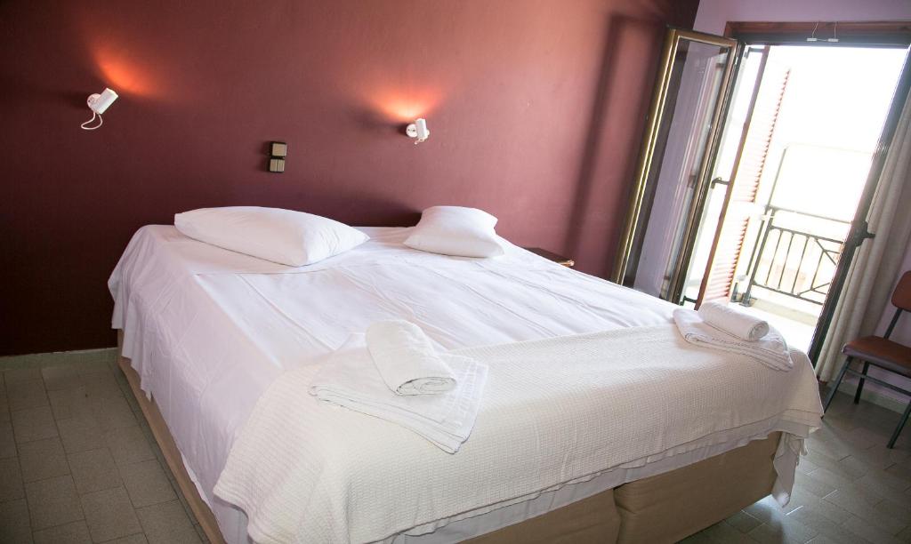 Postel nebo postele na pokoji v ubytování Petania Hotel & Apartments