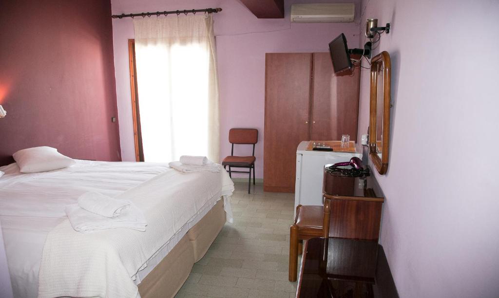Postel nebo postele na pokoji v ubytování Petania Hotel & Apartments