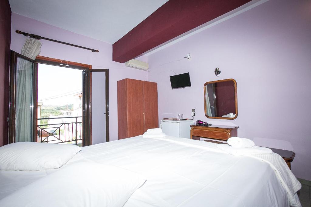 Postel nebo postele na pokoji v ubytování Petania Hotel & Apartments
