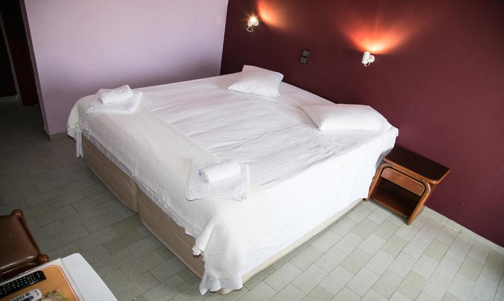 Postel nebo postele na pokoji v ubytování Petania Hotel & Apartments