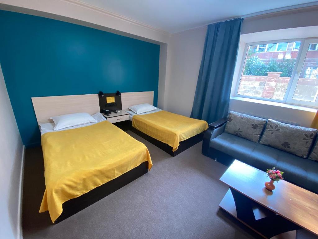 Кровать или кровати в номере Мини Отель Улпан
