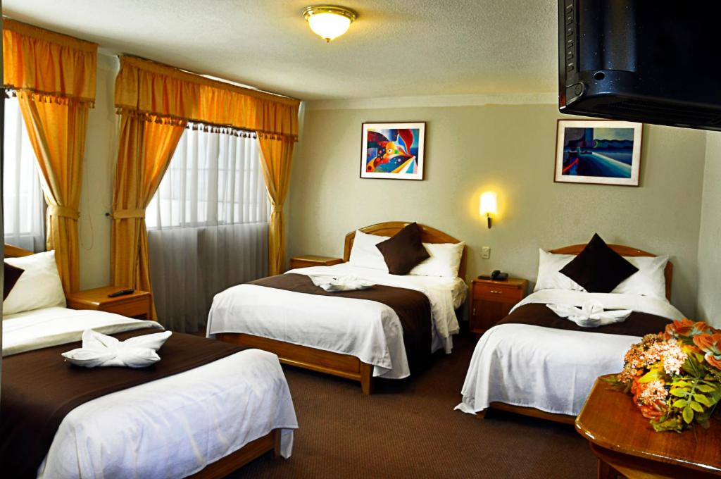 Postel nebo postele na pokoji v ubytování Casona Plaza Balsa Inn