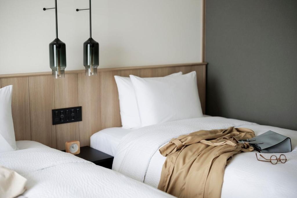 Postel nebo postele na pokoji v ubytování Fairfield by Marriott Wakayama Kumano Kodo Susami