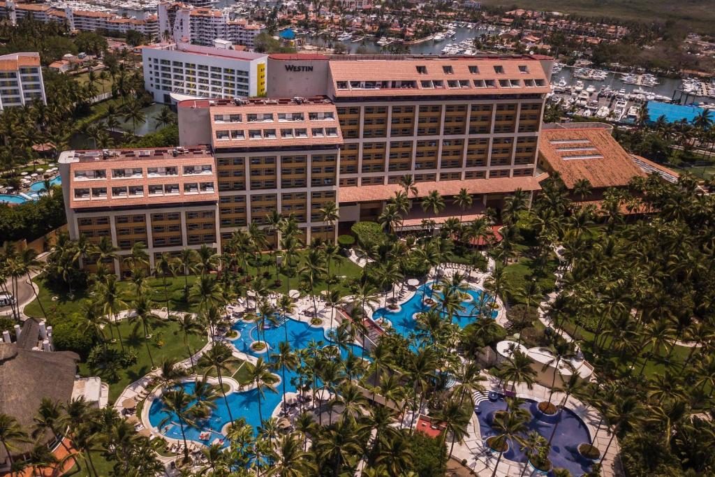 an aerial view of a resort with pools and trees at The Westin Resort & Spa, Puerto Vallarta in Puerto Vallarta