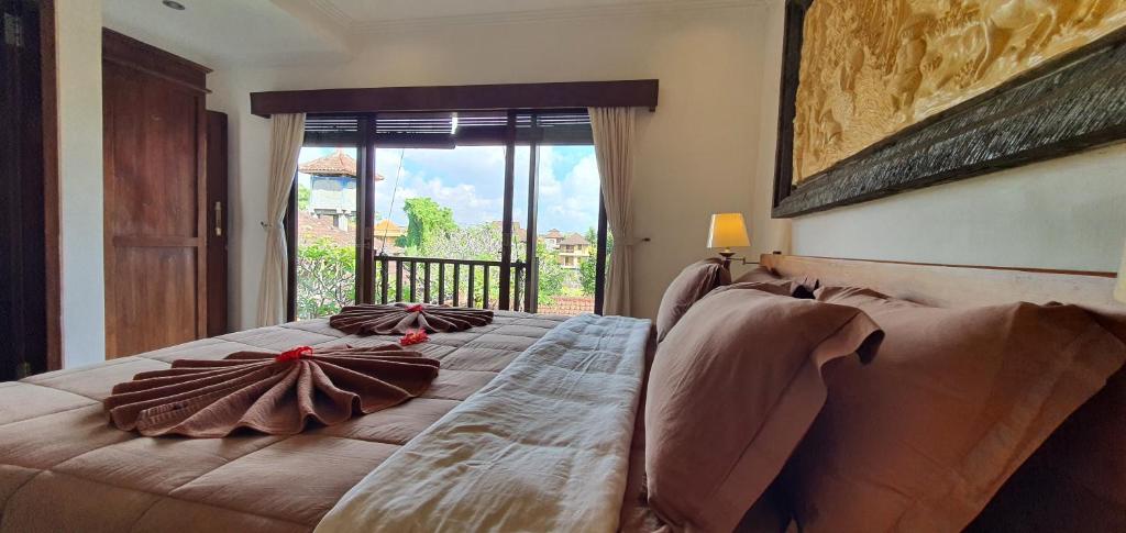 Posezení v ubytování Kun - Kun Guest House Ubud