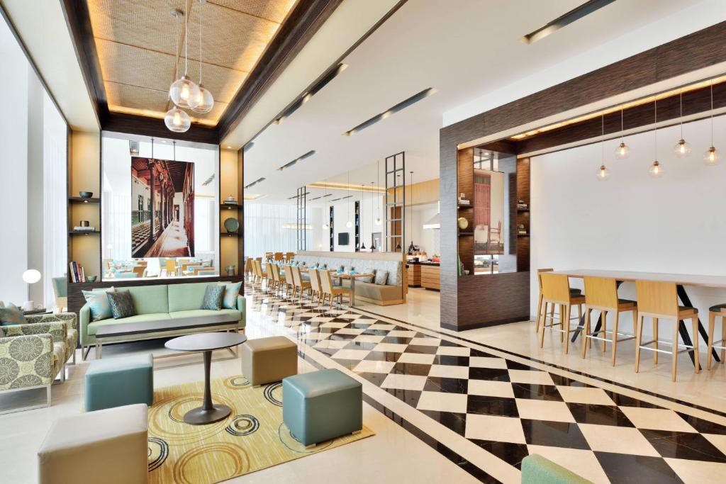 a lobby with a checkered floor at Fairfield by Marriott Sriperumbudur in Sriperumbudur