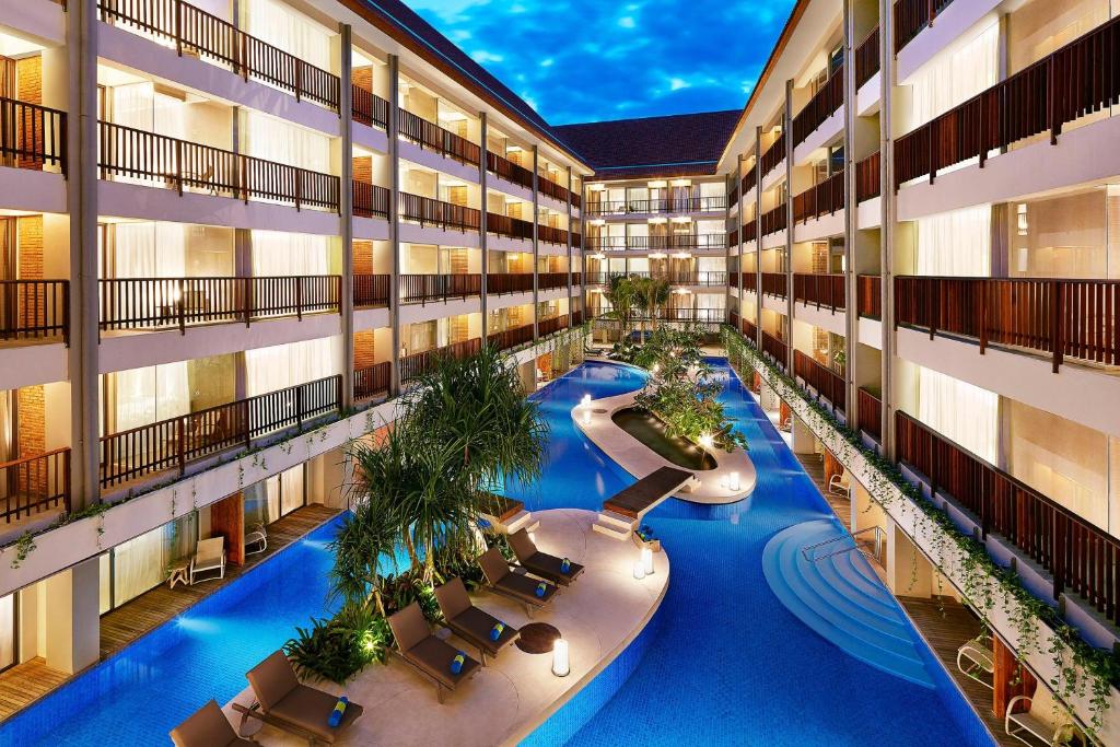 an overhead view of an apartment building with a swimming pool at Four Points by Sheraton Bali, Kuta in Kuta