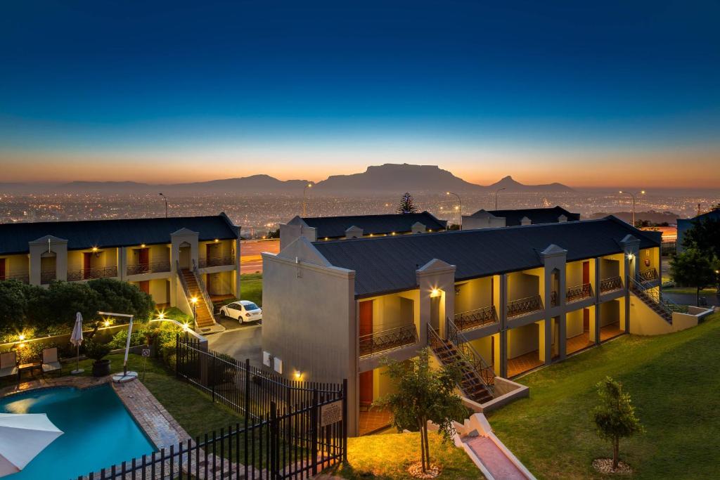 an aerial view of a house with a swimming pool at Protea Hotel by Marriott Cape Town Tyger Valley in Bellville