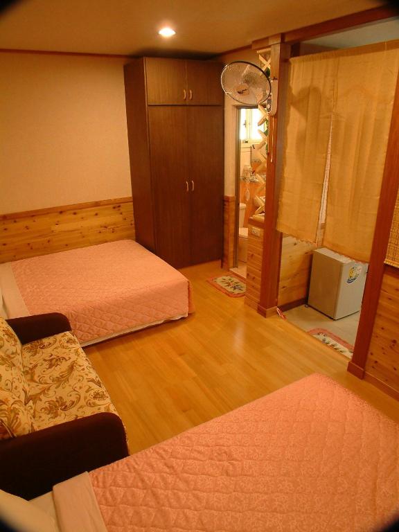 Postel nebo postele na pokoji v ubytování Donglifang B&B