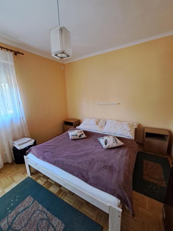 Postel nebo postele na pokoji v ubytování Pintér Apartman