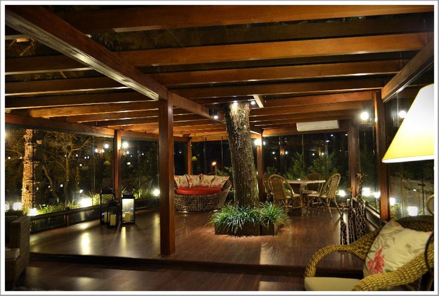 Uma área de estar em Pousada do Verde Gramado