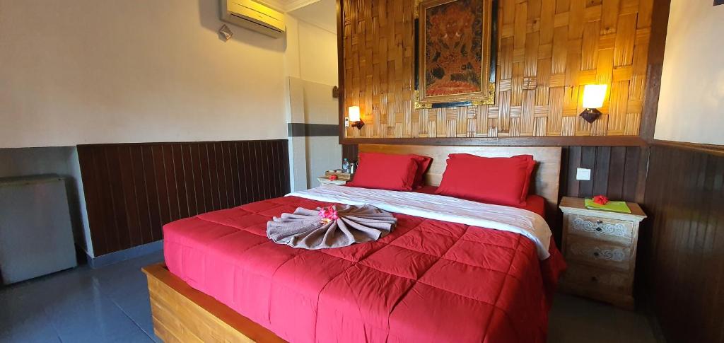 Postel nebo postele na pokoji v ubytování Kun - Kun Guest House Ubud