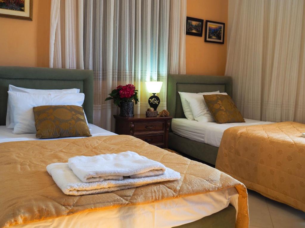 A bed or beds in a room at Villa Antikleia