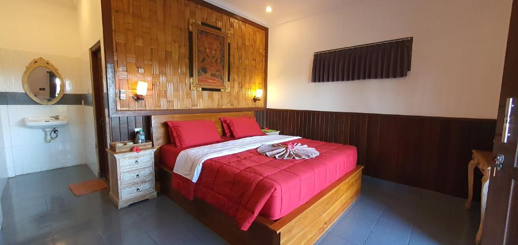 Postel nebo postele na pokoji v ubytování Kun - Kun Guest House Ubud