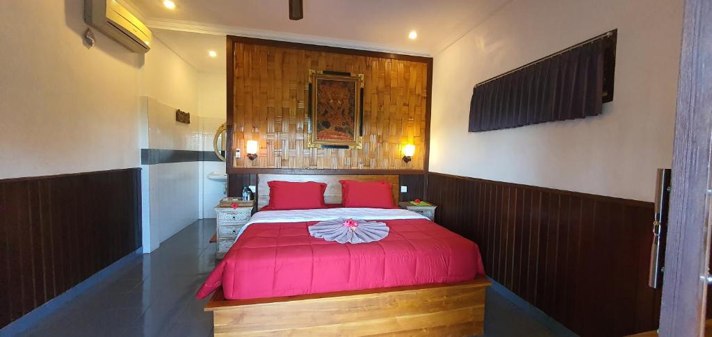 Postel nebo postele na pokoji v ubytování Kun - Kun Guest House Ubud