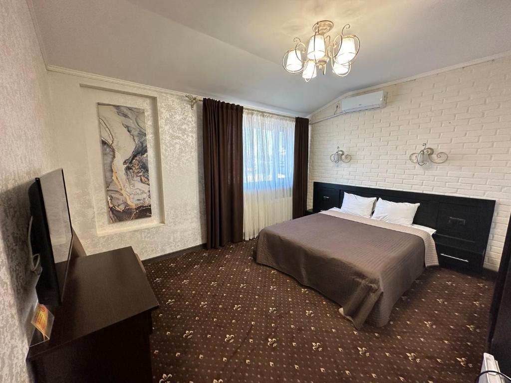 Кровать или кровати в номере Hotel Merry Club