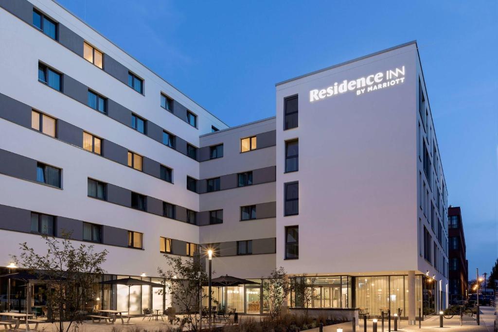 a building with a sign on the side of it at Residence Inn by Marriott Hamburg Altona in Hamburg