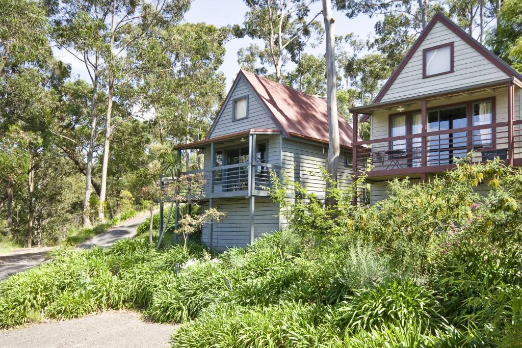 a house on the side of a road at Great Ocean Road Cottages in Lorne
