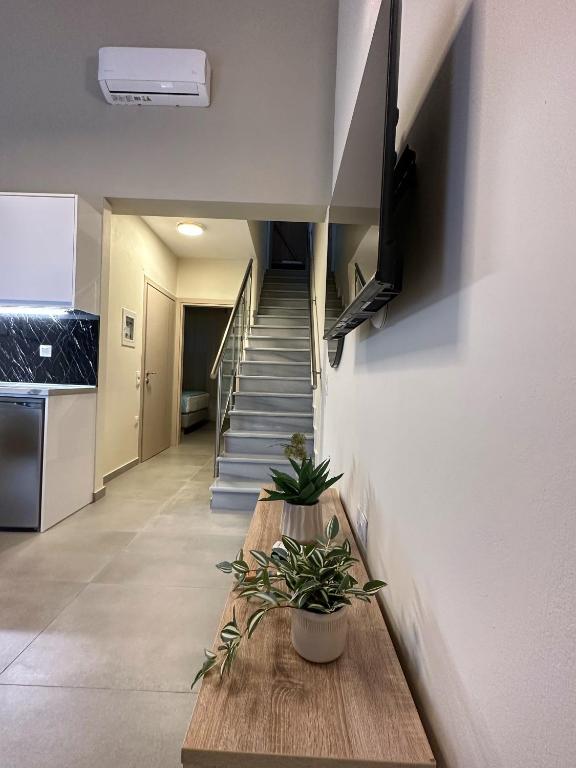 TV a/nebo společenská místnost v ubytování Bianco Mare Studios-Apartments