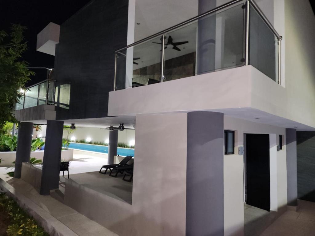 an external view of a house with a swimming pool at Astoria Gated Condos in Cancún