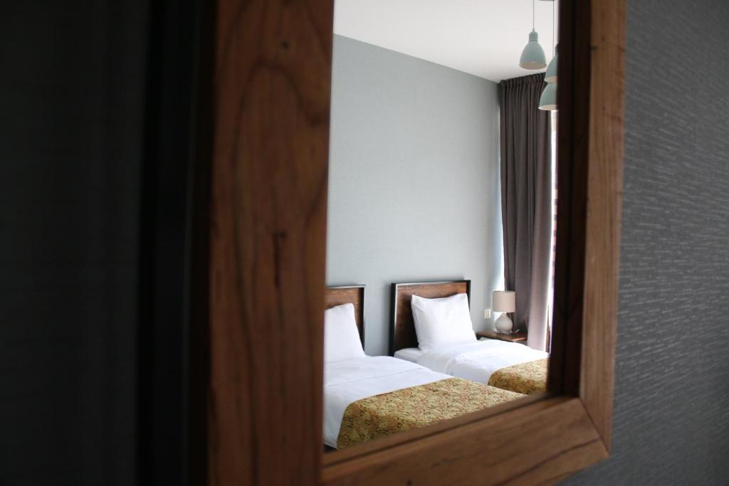 Postel nebo postele na pokoji v ubytování Capra Hotel Kazbegi
