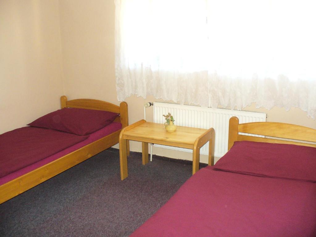 Postel nebo postele na pokoji v ubytování Penzion Tágo Bohumín