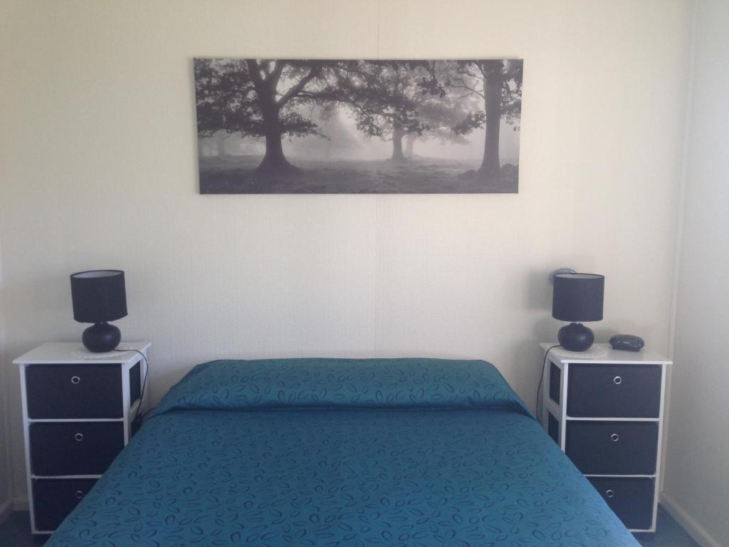 Letto o letti in una camera di Phillip Island Cottages