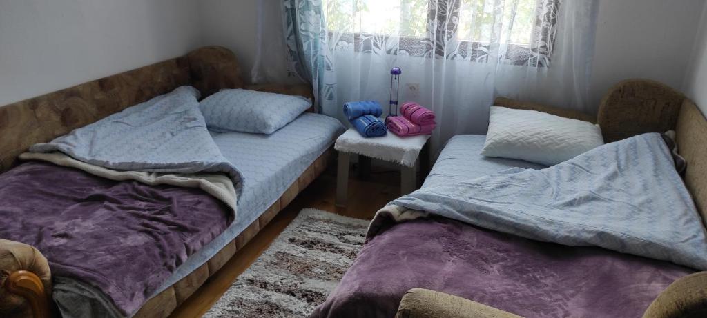 Postel nebo postele na pokoji v ubytování 202