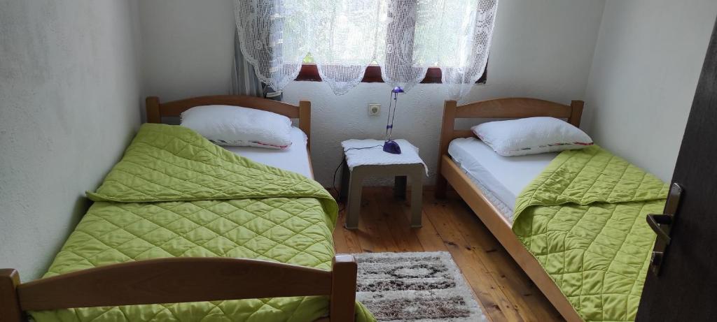 Postel nebo postele na pokoji v ubytování 202