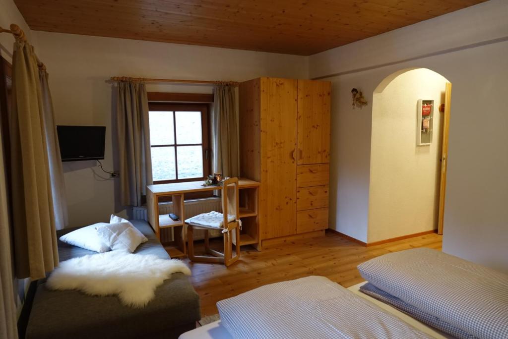 Postel nebo postele na pokoji v ubytování Hinterauerhof