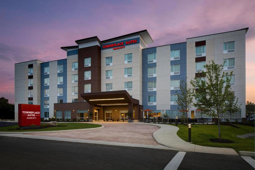 a rendering of a hotel building at dusk at TownePlace Suites by Marriott Pittsburgh Harmarville in Harmarville