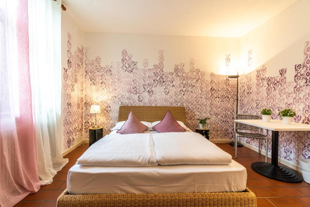 Postel nebo postele na pokoji v ubytování Sleep In Venzone Depandance