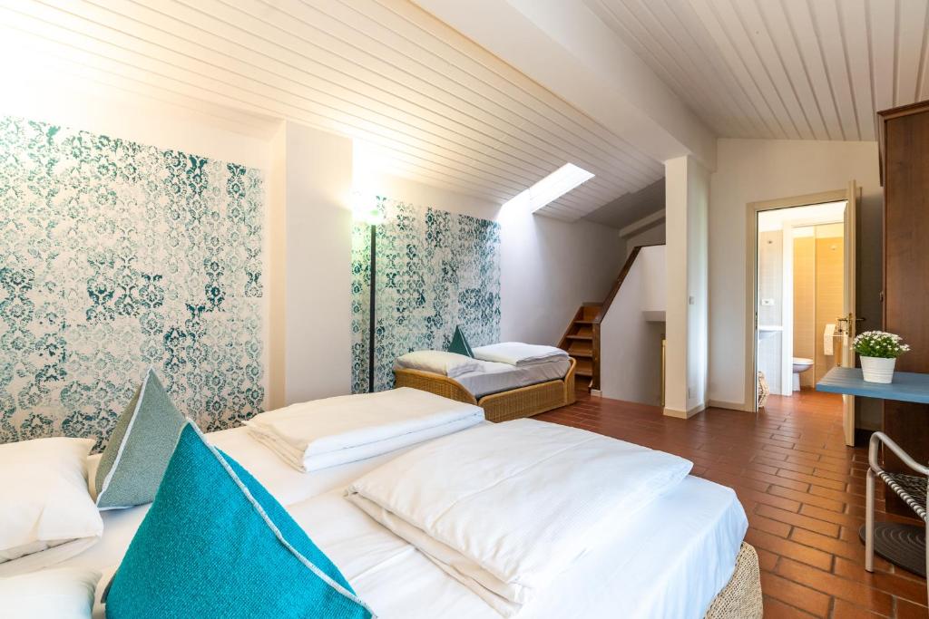 Postel nebo postele na pokoji v ubytování Sleep In Venzone Depandance