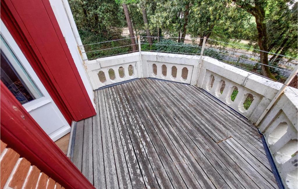 a balcony with a wooden floor and a railing at Stunning Home In Saint-palais-sur-mer With Wifi And 6 Bedrooms in Saint-Palais-sur-Mer