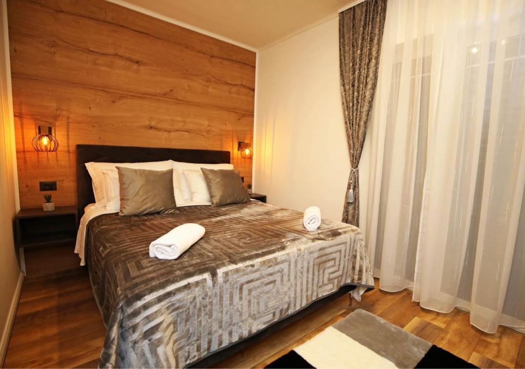 Postel nebo postele na pokoji v ubytování Apartmani Krka Rooms