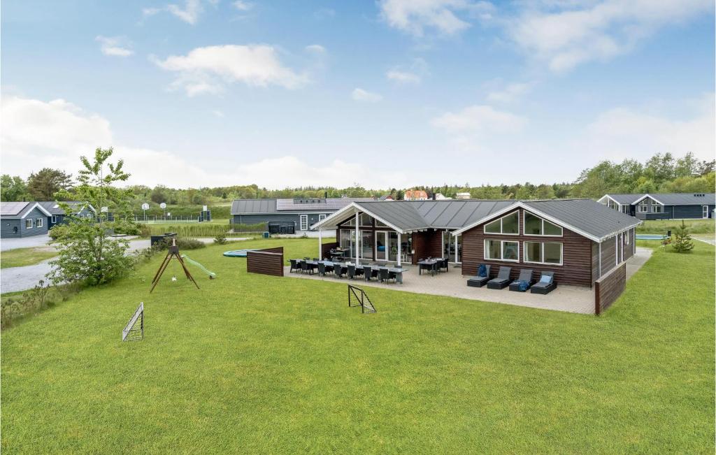 an aerial view of a house with a playground at Beautiful Home In lbk With Kitchen in Ålbæk