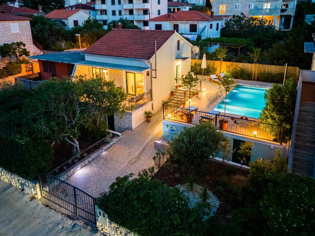 an aerial view of a house with a swimming pool at Holiday Home Josipa in Supetar