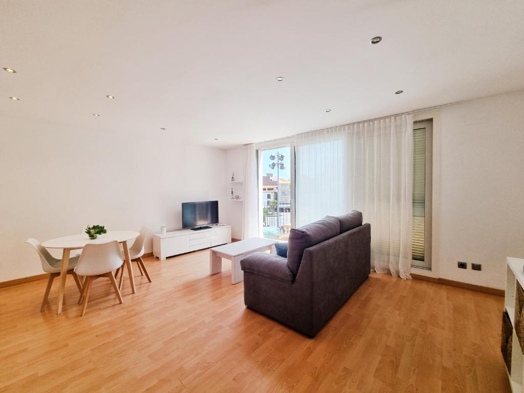 Televízia a/alebo spoločenská miestnosť v ubytovaní Apartamento Penelope