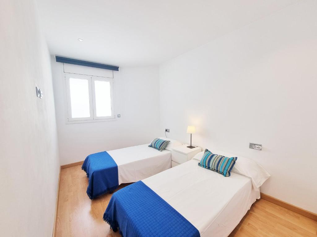Posteľ alebo postele v izbe v ubytovaní Apartamento Penelope