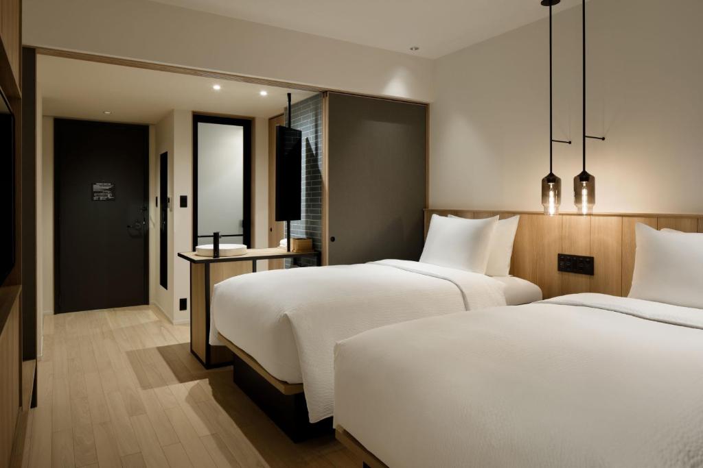 Postel nebo postele na pokoji v ubytování Fairfield by Marriott Mie Kumano Kodo Mihama