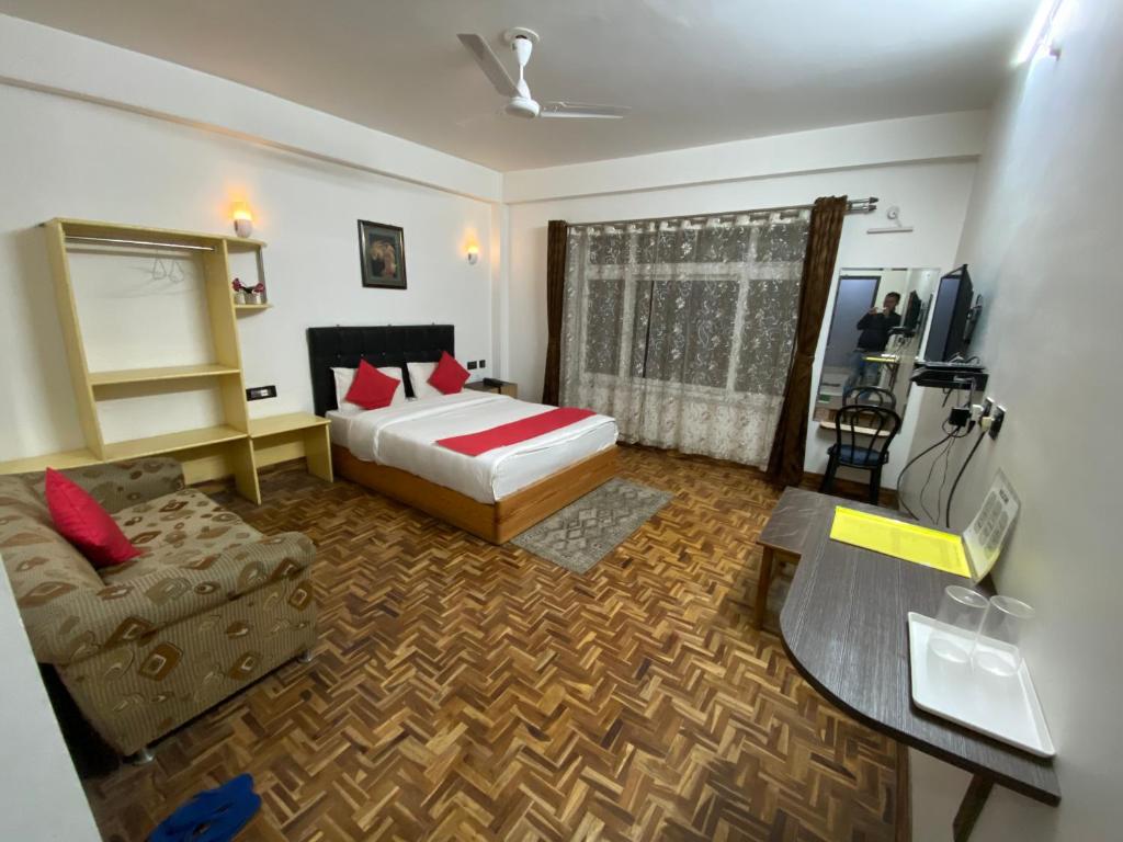 Postel nebo postele na pokoji v ubytování Hidden Gem Residency
