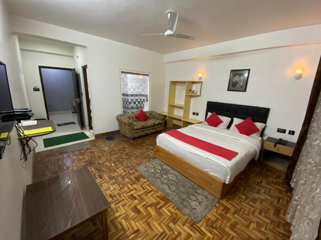 Postel nebo postele na pokoji v ubytování Hidden Gem Residency