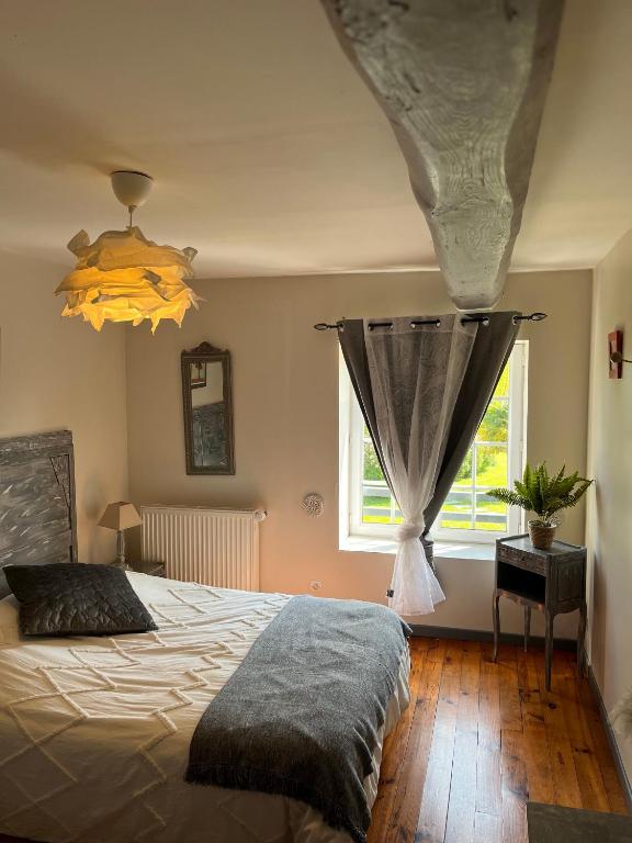 Postel nebo postele na pokoji v ubytování La Naomath - Maison d'hôtes, Hébergement insolite & Gîte