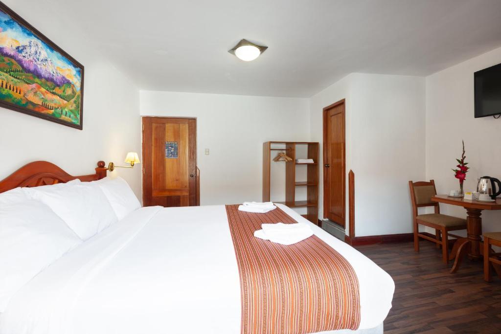 Postel nebo postele na pokoji v ubytování Hotel Amerinka