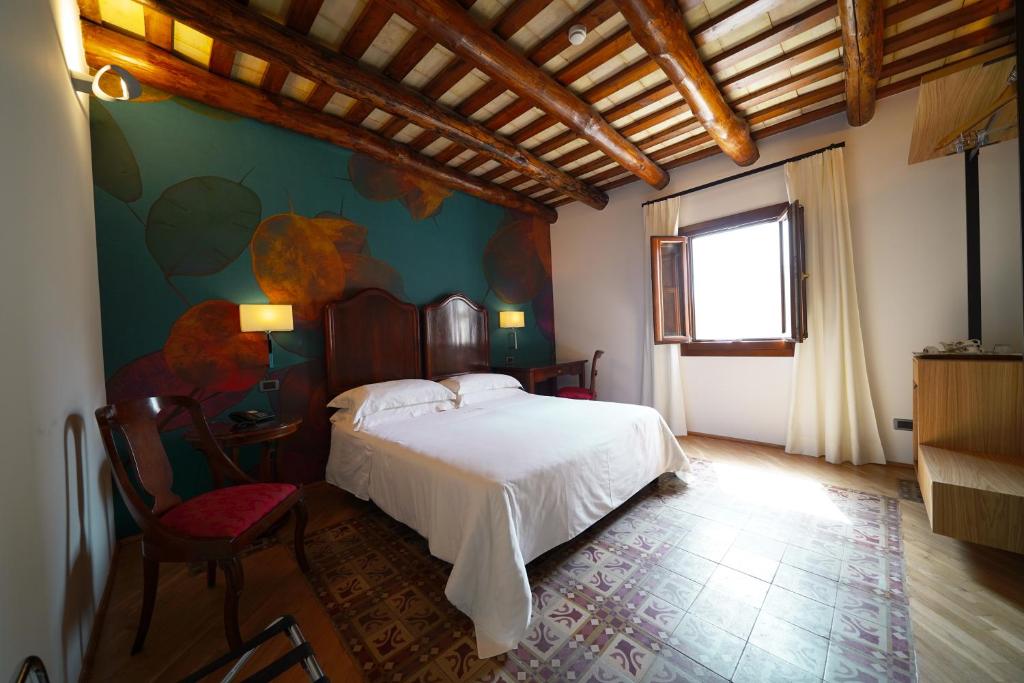 Voodi või voodid majutusasutuse Hotel Carmine toas